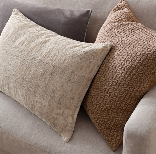 Ashby cushion styled with brown and grey cushions